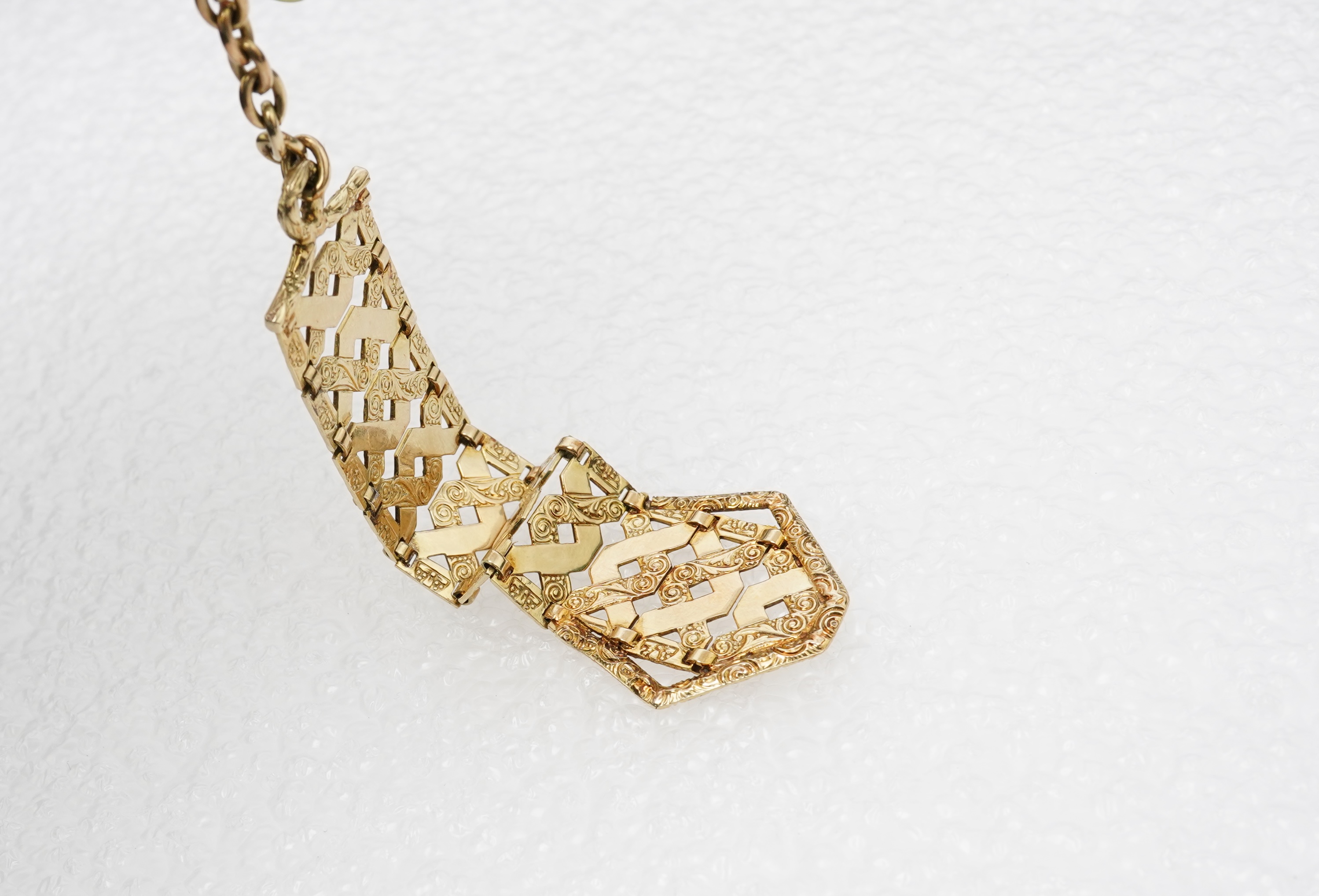 An unusual gold pendant, early 20th century